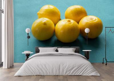 persian sweet lemons (citrus limetta) with a dark blue background Wall mural