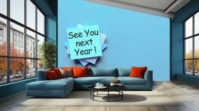 See you next year written on a note pile at the office, mockup. Empty text for text Wall mural