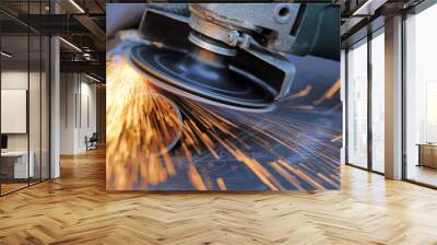 Worker cutting metal with grinder Wall mural