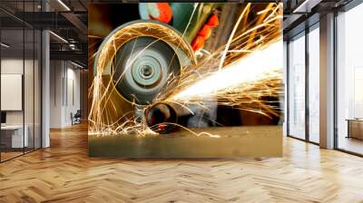 Worker cutting metal with grinder Wall mural