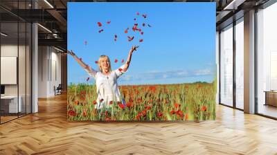 Young beautiful girl in the poppy Wall mural