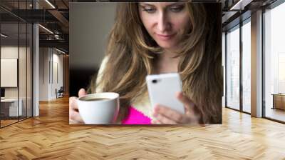 Young girl, sitting in a cafe with cup of coffee Wall mural