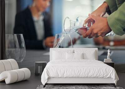 Business staff, hands and pouring water into glass of a employee ready for a meeting. Drink, office workers and conference room table with employee group and strategy documents for discussion Wall mural