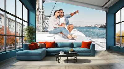 Couple, love and yacht with a man and woman out at sea or on the ocean for romance and a luxury date or cruise. Happy, trust and care with a young male and female on a boat in the water together Wall mural