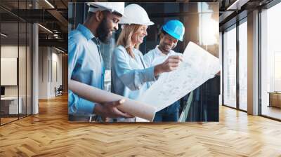 Architecture, construction building with an architect, engineer and designer working as a team and reading a blueprint. Teamwork, collaboration and development with a group of creative staff Wall mural