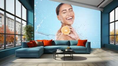 Water, lemon and woman with happy skincare, beauty or cosmetics product in studio or shower mockup for vegan advertising. Wellness model with fruit in hands and splash for healthy dermatology glow Wall mural