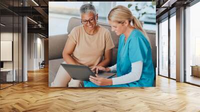 Laptop, healthcare and assisted living with a woman and nurse talking about test results in a retirement home. Computer, medicine and medical with a female health professional and patient in a house Wall mural