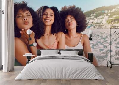 Woman group, beach vacation and lips blow kiss with happiness, sunshine and natural african hair. Happy black woman, friends and ocean sand in portrait pouting, bonding and together on summer holiday Wall mural