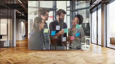 do you have any ideas. shot of creative businesspeople having a brainstorming session. Wall mural