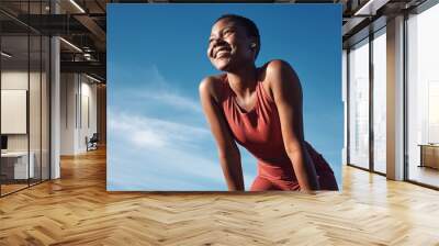 Fitness, black woman and happy athlete smile after running, exercise and marathon training workout. Blue sky, summer sports and run of a African runner breathing with happiness from sport outdoor Wall mural