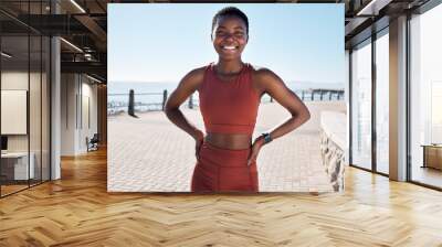 Fitness, portrait or black woman runner ready for cardio training, workout or exercise by a beach in Cape Town. Wellness, face or healthy sports girl with a happy smile or freedom with body goals Wall mural