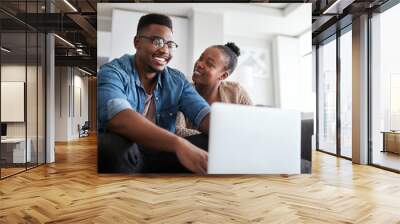 Laptop, happy and internet with a black couple online, browsing social media or looking for a movie to watch. Ecommerce, computer and series with a man and woman in the home living room to relax Wall mural