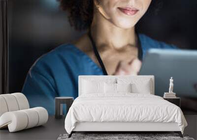 Medical tablet, nurse and black woman in hospital working late on telehealth, research or online consultation. Tech, healthcare or female physician with technology for wellness app in clinic at night Wall mural