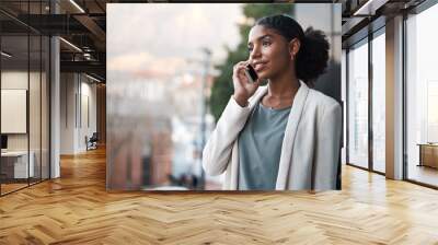 Talking on a phone, communication and networking with a young, confident and ambitious young business woman on a balcony. Professional and creative designer on a call for work discussion and planning Wall mural