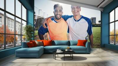 Happy soccer players, team or portrait of men on a field for sports game, practice or fitness training. People, wellness or excited athlete friends hug after a match with smile or support in stadium Wall mural