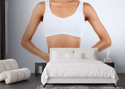 Woman, heart and hands on stomach in studio, diet and holistic gut wellness. Closeup female abdomen, love fingers and belly on background for digestion, balance body and healthy goals to lose weight Wall mural