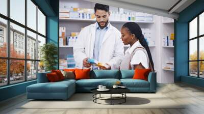 Pharmacy pills, customer question and black woman with pharmacist at a wellness and health store. Happy, drugs ingredients and male healthcare professional consulting about product and medicine Wall mural