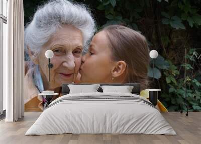 granddaughter and her grandmother talking Wall mural