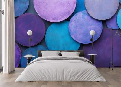 Abstract arrangement of purple and blue circular shapes, textured surface. Modern art concept Wall mural