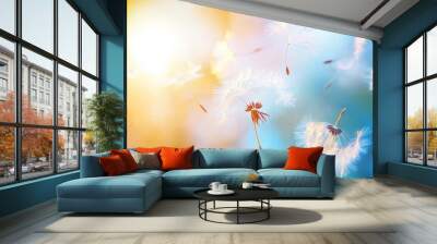 Dandelion seeds blowing in the wind against sunset backdrop, ethereal nature scene. Freedom and tranquility concept Wall mural