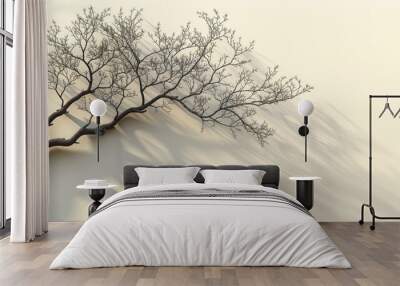 Leafless tree branch casting long shadow on beige background, minimalist nature scene Wall mural