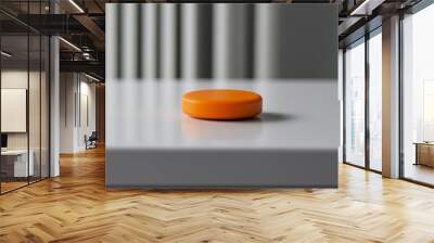 Orange disc on white table with blurred background, minimalism concept Wall mural