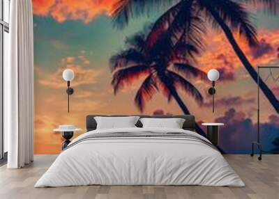 Palm trees on tropical beach at sunset, colorful sky. Relaxation and nature concept Wall mural