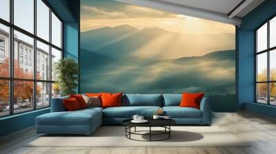 Sunrise over misty mountain range with sun rays, serene landscape Wall mural