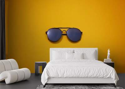 top view sunglasses on colorful background. Wall mural