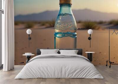 Bottle of drinking water stand in desert, a bottle of clean drinking water Wall mural