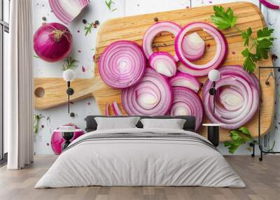 Board with slices of fresh red onion on white wooden background Wall mural