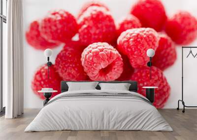 handful of raspberry berries on white background Wall mural