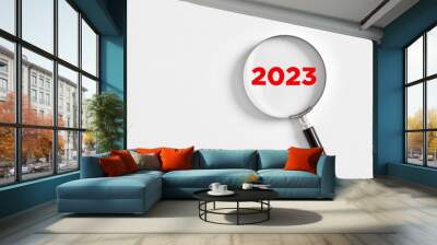 Magnifying glass magnifies the year 2023 on white background. Focusing on the year 2023 for business planning Wall mural