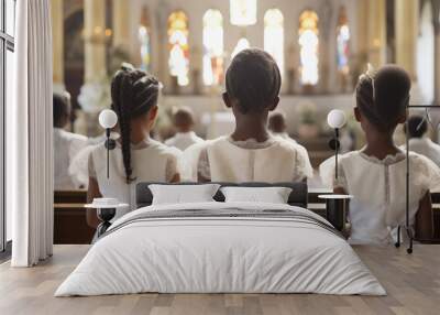 Group of young black girls in elegant attire gathered near the church altar with candles and a crucifix. Back shot attending a religious service or ceremony. First communion concept. Wall mural