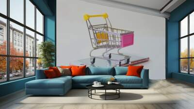 Mini Shopping Cart on Smartphone . Concept of Online Shopping. Wall mural