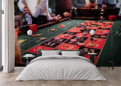 Roulette game. Players place bets. Wall mural