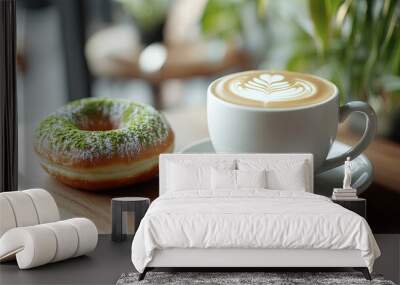 Matcha donuts with cup of coffee on table Wall mural