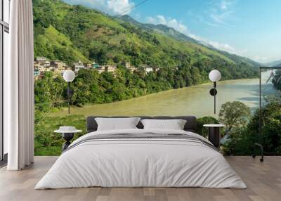 Natural landscape with a view of the Cauca river and blue sky. Puerto Valdivia, Antioquia, Colombia. Wall mural