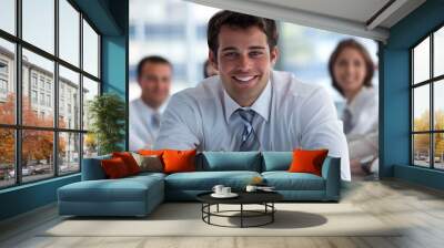 A confident young adult leading a team meeting in a corporate setting Wall mural