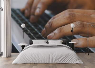 Close up shot of hands of unrecognizable afro-american businessman typing on laptop keyboard. High quality photo Wall mural