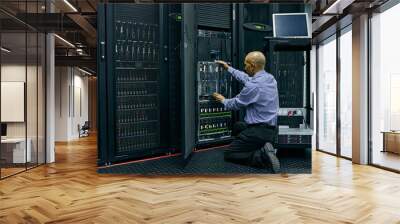 Database, software and a man engineer in a server room for cybersecurity maintenance on storage hardware. Computer network or mainframe with a technician working on information technology equipment Wall mural