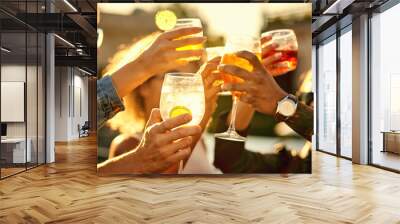 In the end, all that matters is happiness. Cropped shot of a group of unrecognizable friends having a drink and spending the day outside on a rooftop. Wall mural