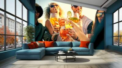 Time spent having fun is time well spent. Shot of a group of young friends hanging out and having drinks together outdoors. Wall mural