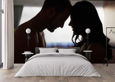 Touching, silhouette and couple in home for affection with love, sexual bonding or trust. Pleasure, relationship and people in bedroom for romance on valentines day, anniversary and sensual passion Wall mural