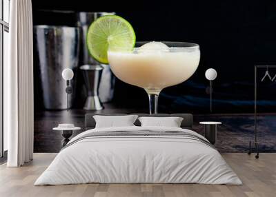 White Chocolate Gimlet Gin Cocktail with Ice Sphere: Cocktail made with gin, lime cordial, and white chocolate liquer in a coupe glass Wall mural