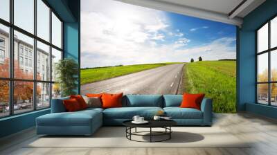 asphalt road panorama in countryside on sunny spring day Wall mural