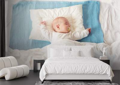 baby sleeping on blue blanket Wall mural