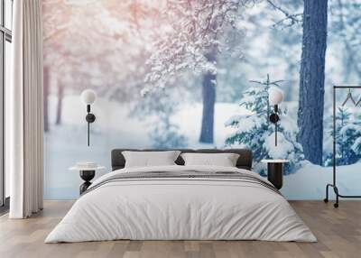 Beautiful tree in winter landscape in late evening in snowfall Wall mural