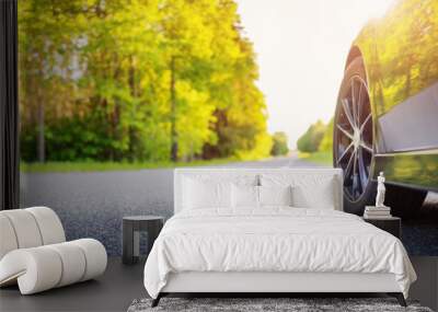 Black car on the country asphalt road in summer. Wall mural