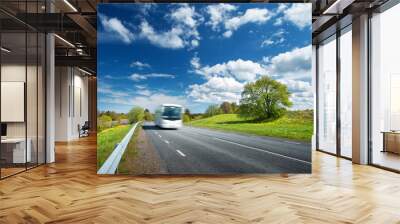 Bus on asphalt road in beautiful spring day Wall mural